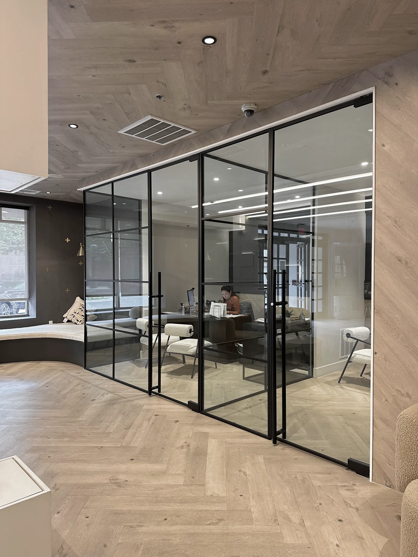 Private office glass partition run with 48-inch handles by WiseGlass NY