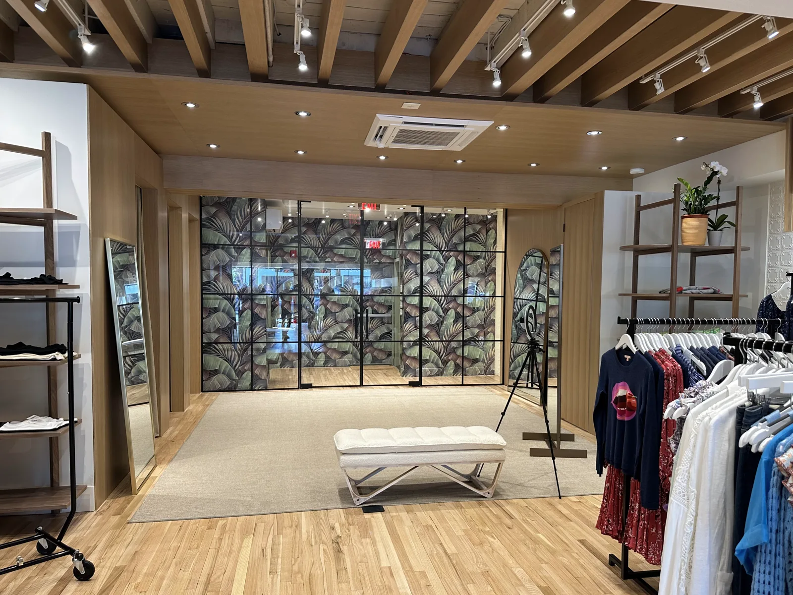Clothing store entrance with black grid glass storefront by WiseGlass NY