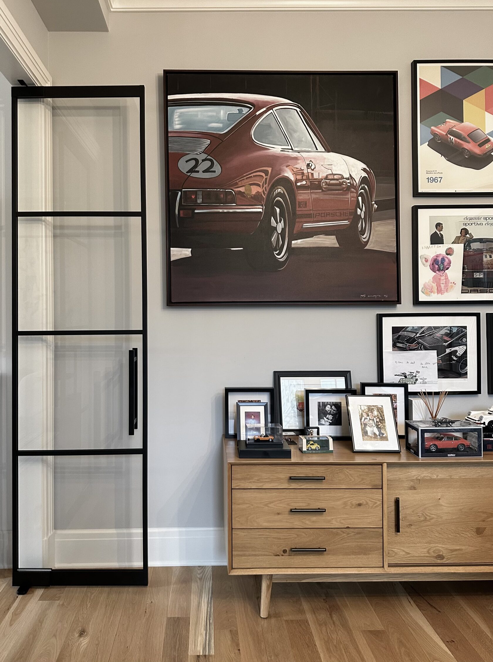 Floor-to-ceiling glass partition in a renovated apartment
