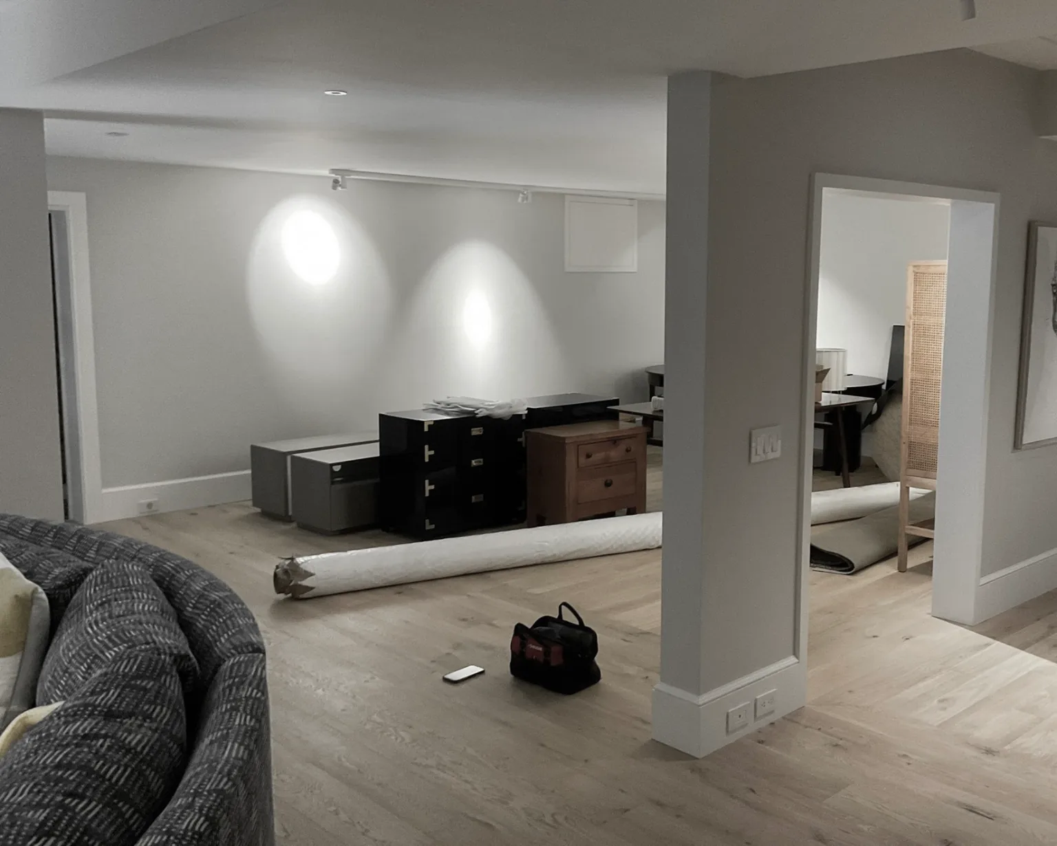 Before — open lower level of a Sagaponack NY estate, gym area exposed to living space prior to glass partition installation by WiseGlass NY