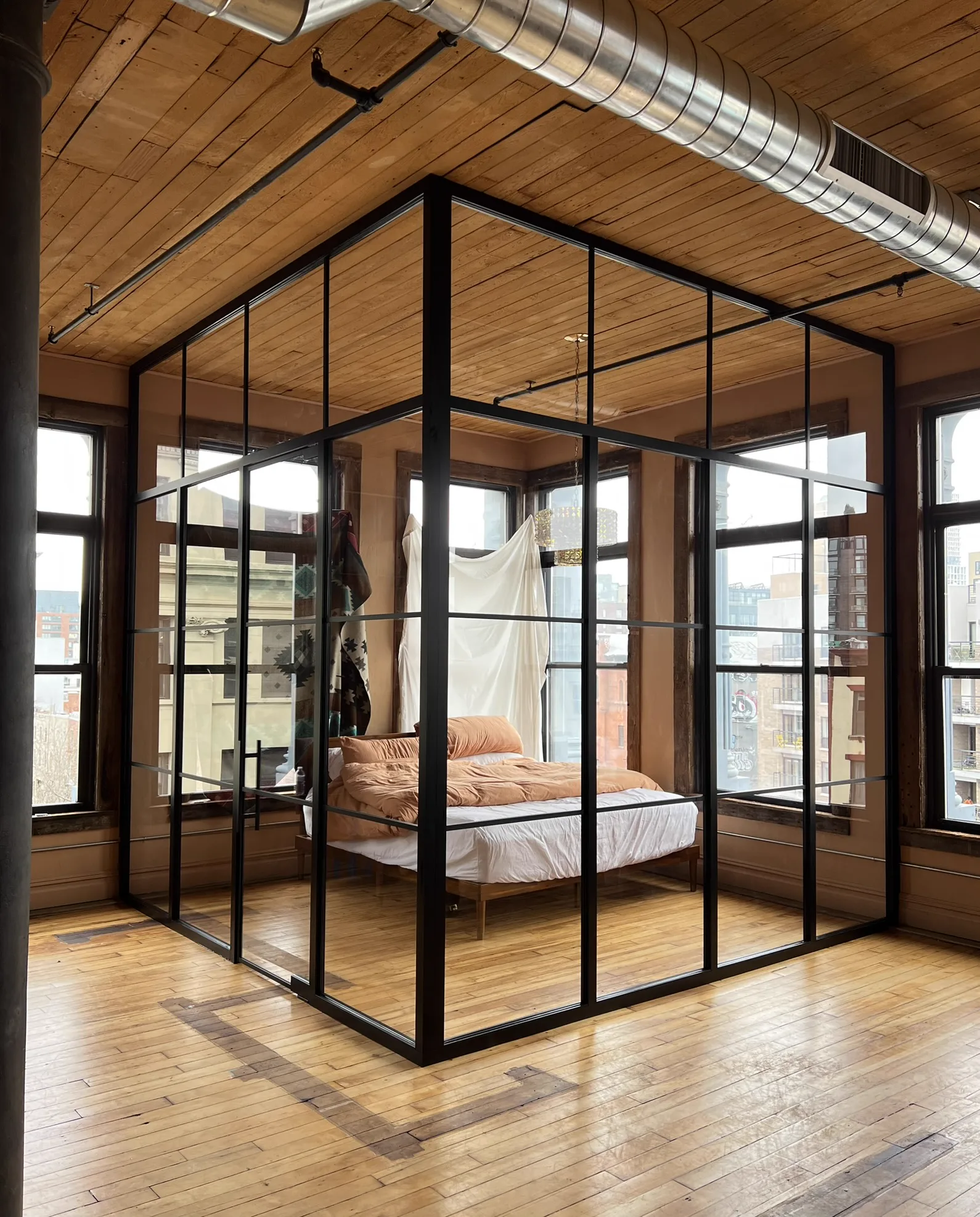 Full glass bedroom enclosure with black matte structural frames in a Williamsburg Brooklyn loft — WiseGlass NY