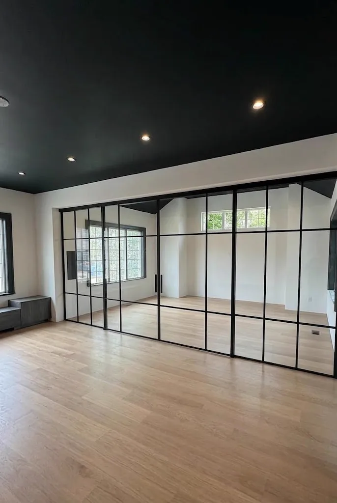 Custom grid glass partition running the length of a vaulted room, upstate New York by WiseGlass NY