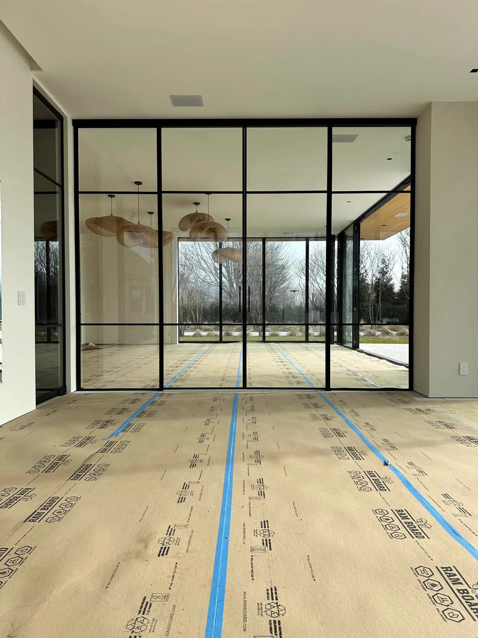 Double sliding glass partition at Water Mill NY estate by WiseGlass NY