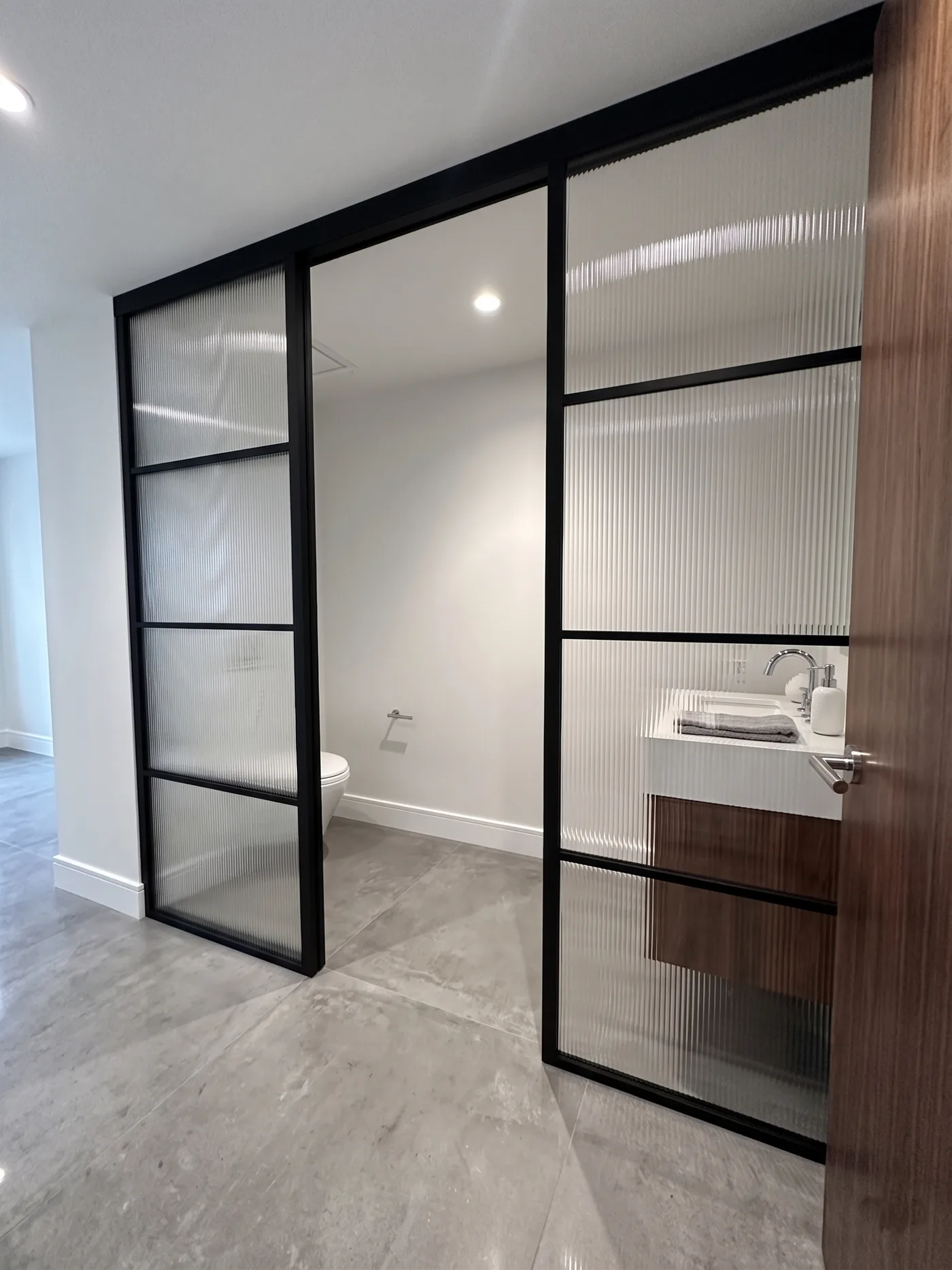 Concept rendering: single sliding door with sidelights and reeded glass