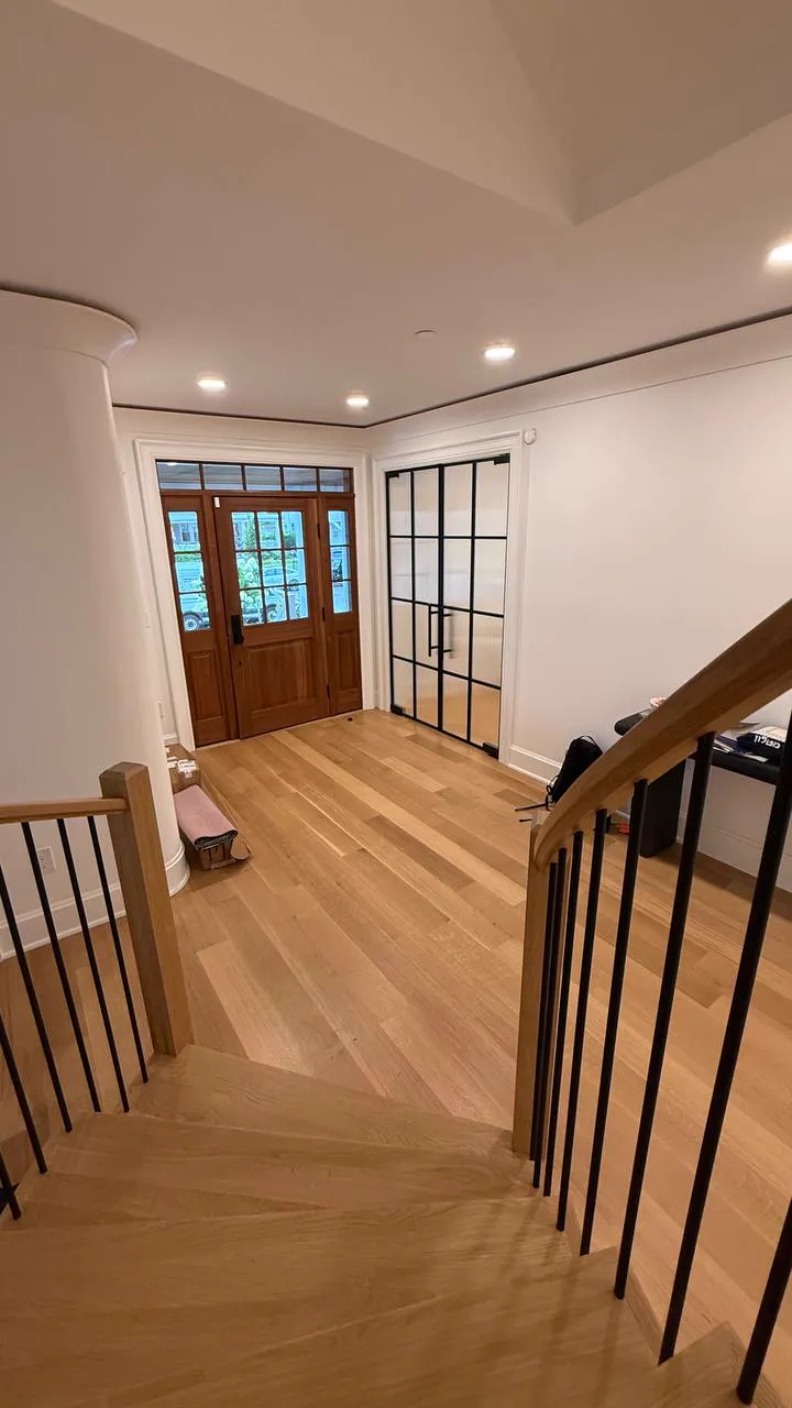 Pair of reeded glass French doors with black grid frames swung open, Allenhurst NJ by WiseGlass NY
