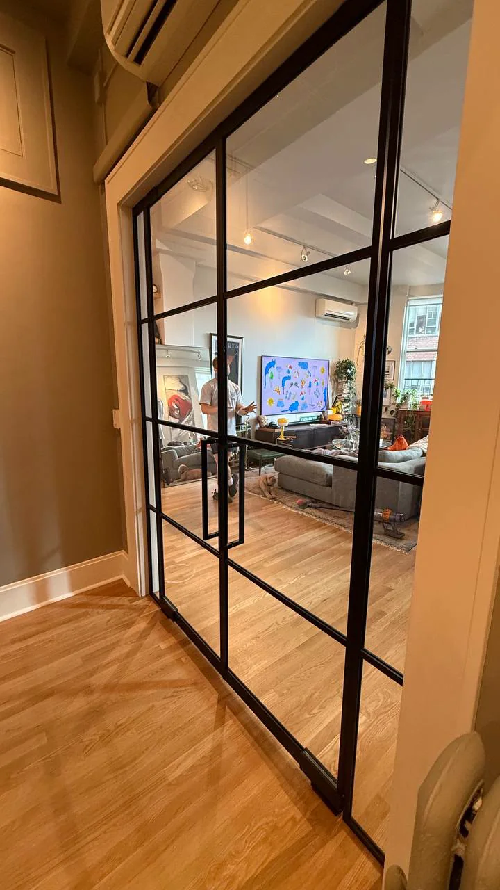 French glass doors with fixed sidelights between a hallway and living room, Manhattan by WiseGlass NY