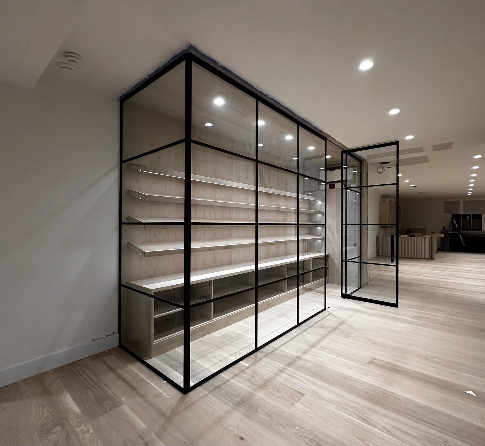 Single swinging glass door with partition wall by WiseGlass NY